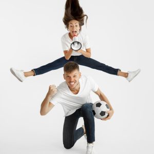 portrait-beautiful-young-couple-football-soccer-fans-facial-expression-human-emotions-advertising-sport-concept-woman-man-jumping-screaming-having-fun_155003-23839